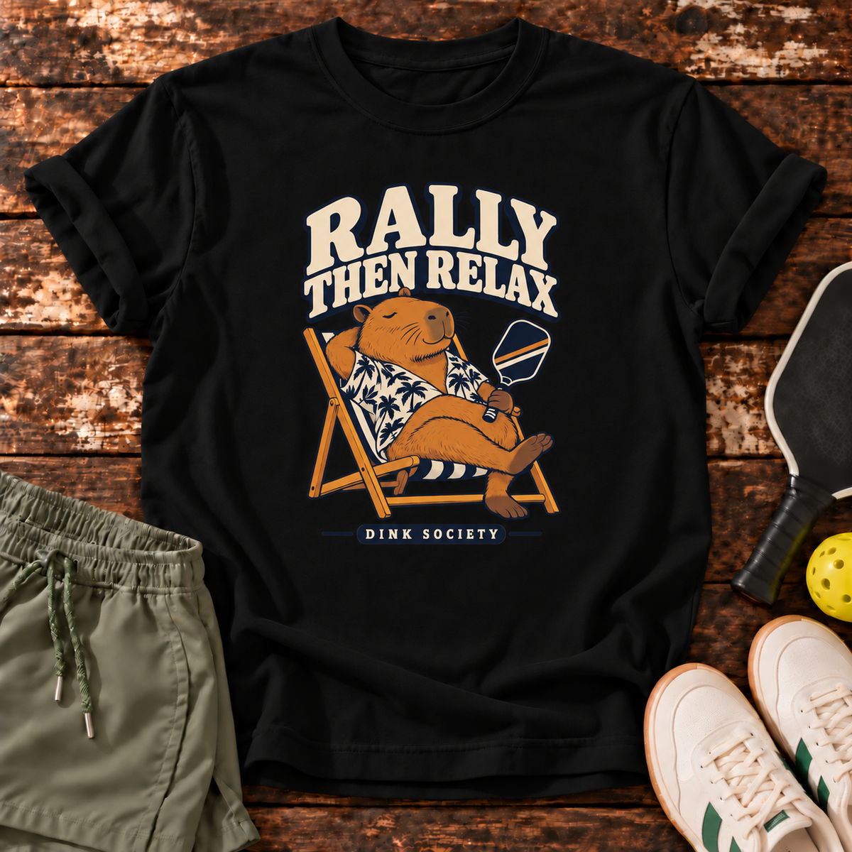 Rally Then Relax T-Shirt — Black — wooden flatlay
